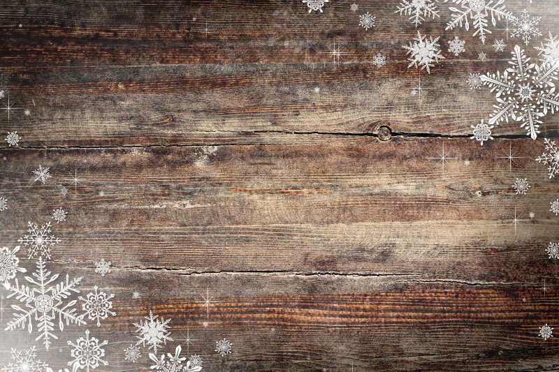 木制背景上的圣诞雪花纹理