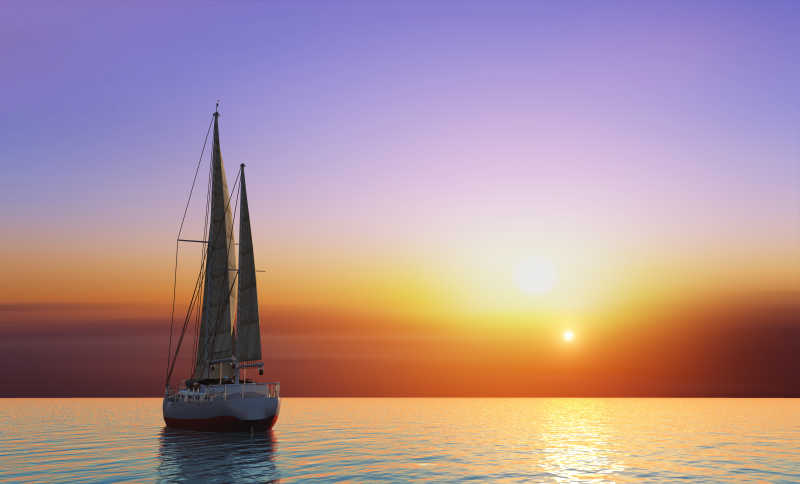 夕阳下全速行驶而下的帆船