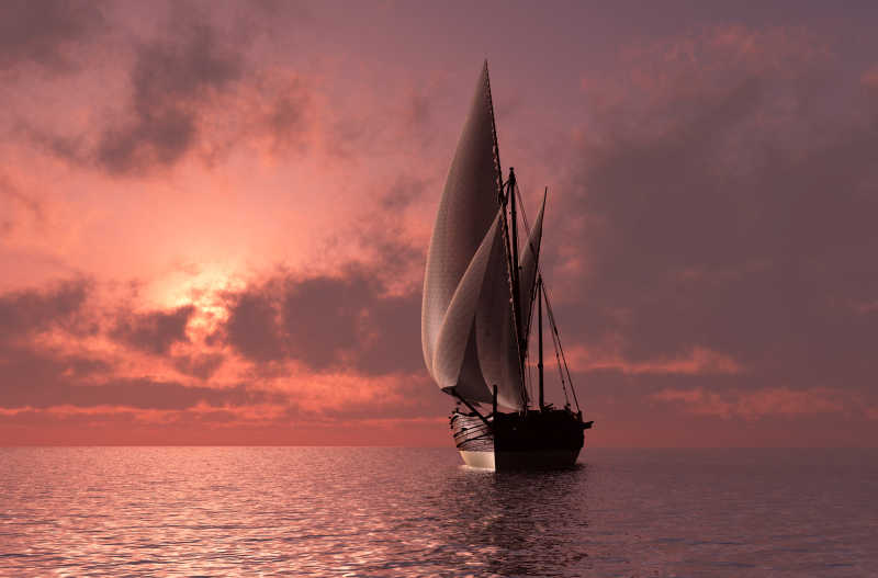 日落时分随风飘荡的帆船