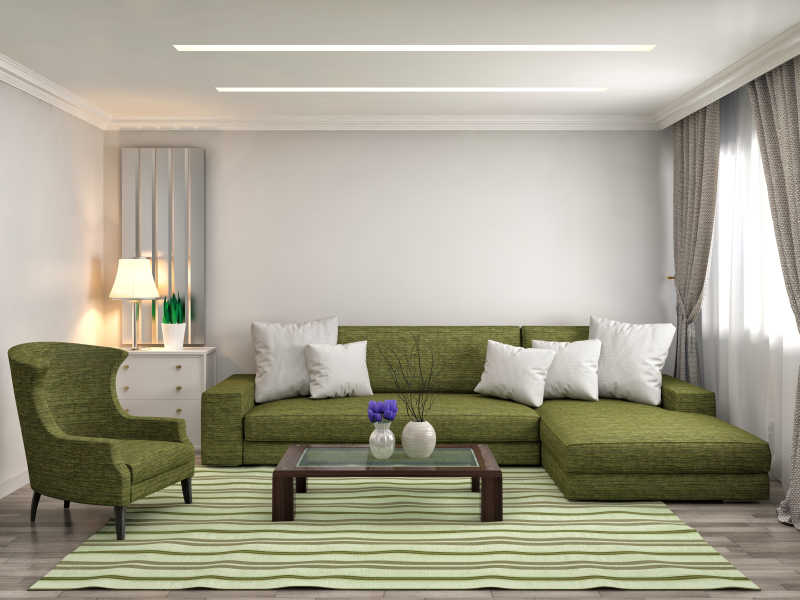 白色房间里的绿色布艺沙发