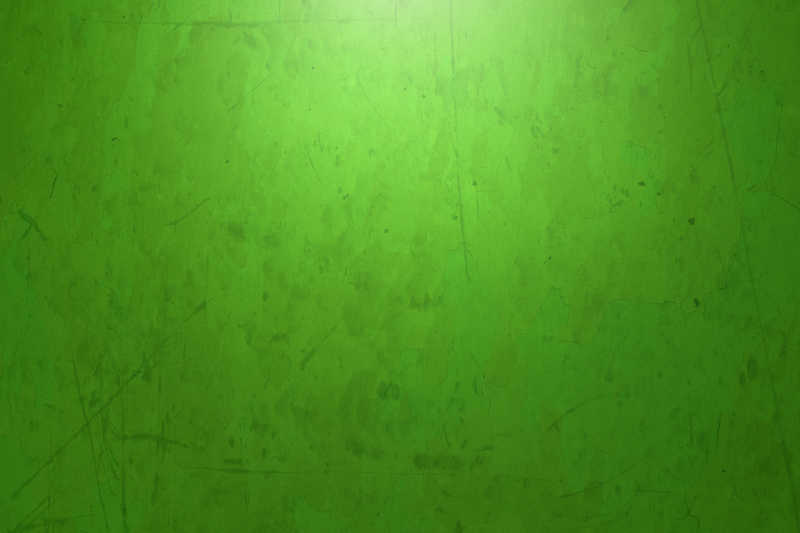 有纹理的斑驳的绿色墙壁背景