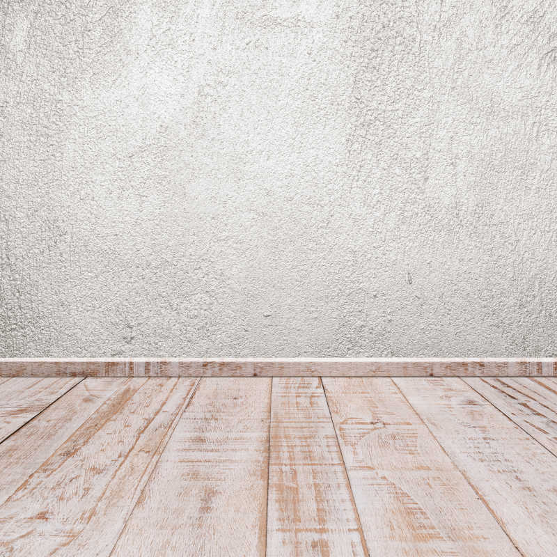 灰白的木质地板和混泥土墙相连接