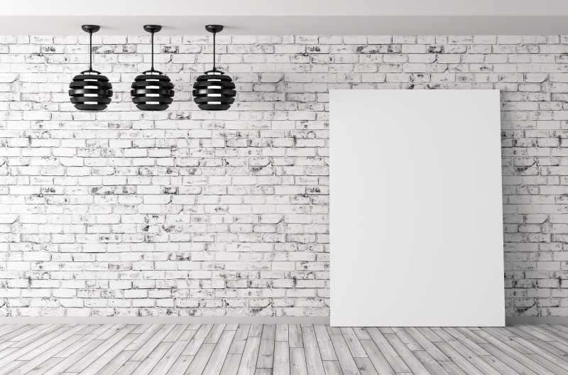 白色现代砖墙背景上的空白画框和吊灯