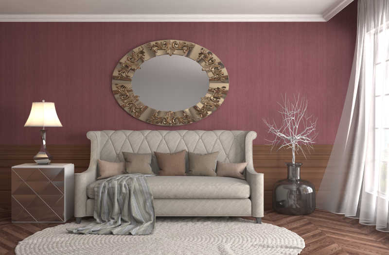 客厅的沙发圆形地毯和豆沙色墙上的圆形装饰