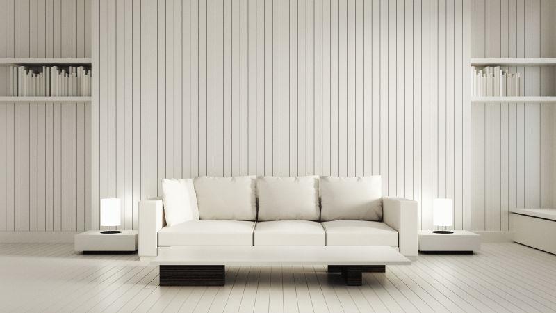 白色现代客厅里白色条纹背景墙前的白色沙发