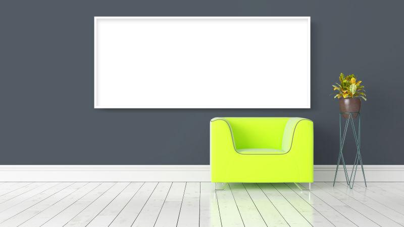 白色木地板上的绿色沙发和灰色背景墙上的白色空白框
