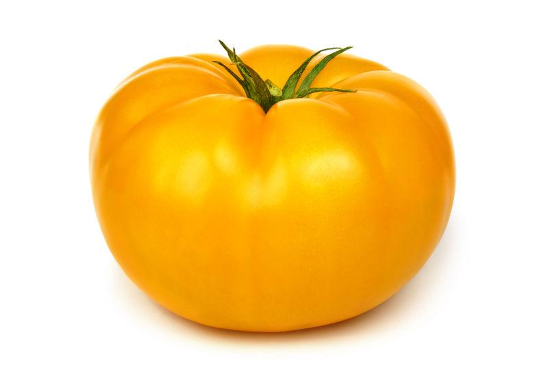 白色背景下美味健康的黄色番茄