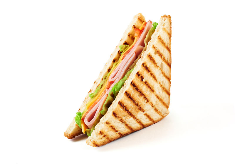 夹火腿奶酪西红柿生菜和烤面包的三明治前视图以白色背景隔离